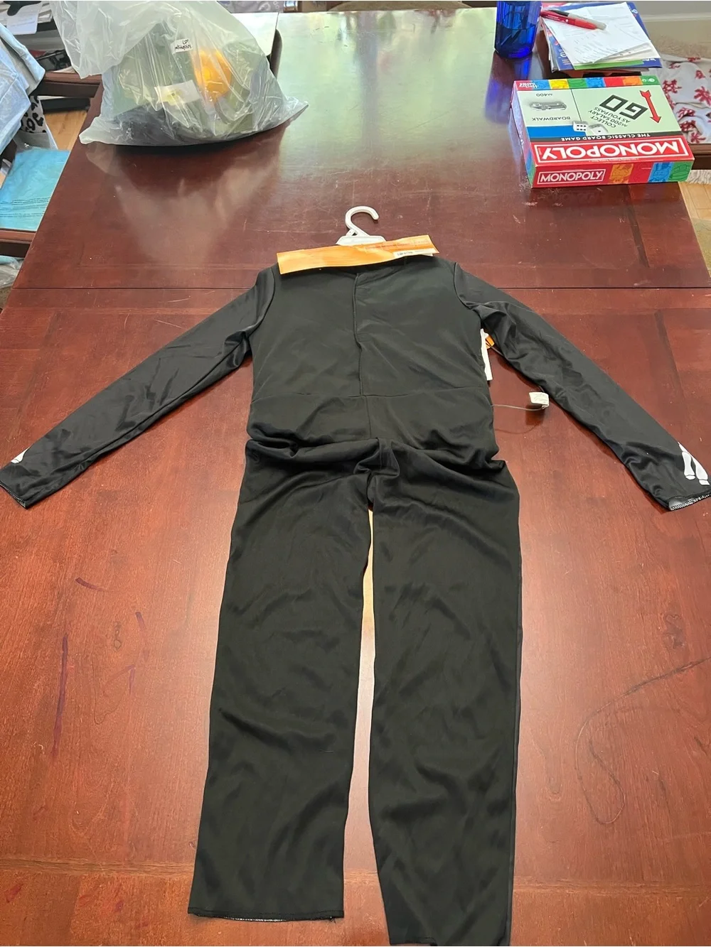 Hyde & EEK! Kids Black Light-Up Skeleton Costume with Glowing Chest (S 6-7)